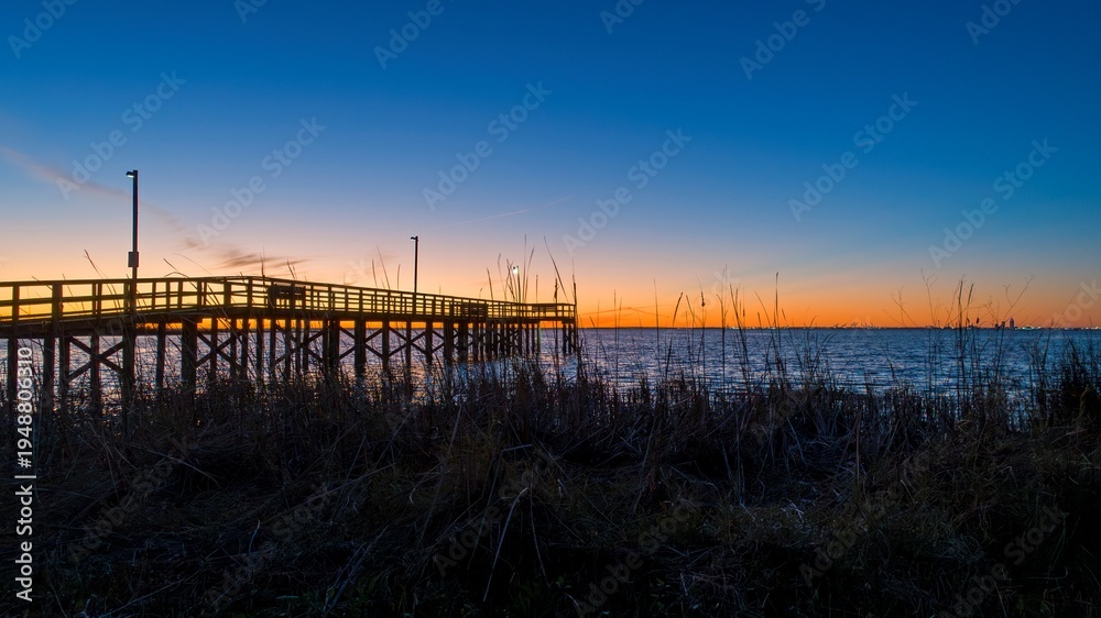 Fototapeta premium Pier on Mobile Bay at sunset
