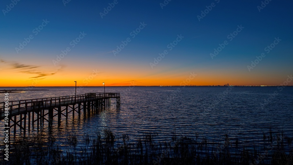 Fototapeta premium Pier on Mobile Bay at sunset