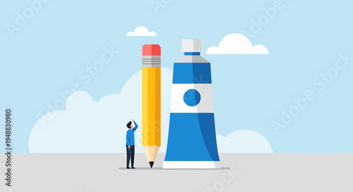 A creative agency team member stands beside a giant pencil and lighthouse on a sunny day.