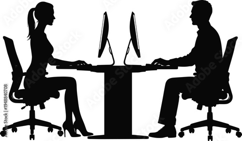 Silhouette of a professional man and woman working on desktop computers at a modern office desk representing teamwork, digital collaboration, and corporate business technology