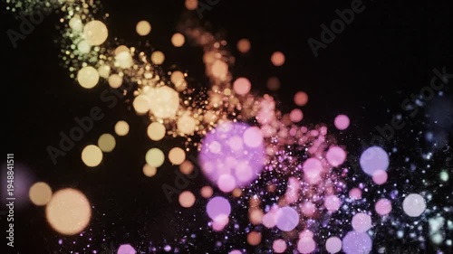 Colorful bokeh lights scatter across a dark background with vibrant purple, pink, and orange hues shining brightly.