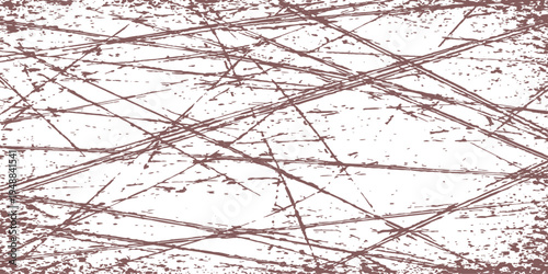 Abstract scratch pattern. The image features a network of intersecting lines, evoking a sense of texture and visual complexity.