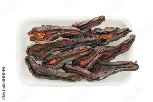 Dried pears in a white container isolated on a white background. Ingredient for preparing a freeze-dried breakfast and other dishes. Top view.