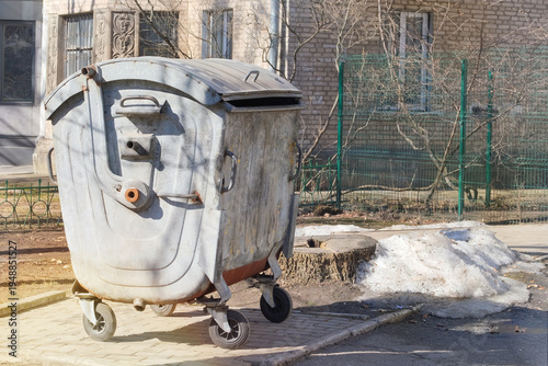 Metal trash can. Garbage, waste lots, junk dump. Dumpsters being full with garbage.