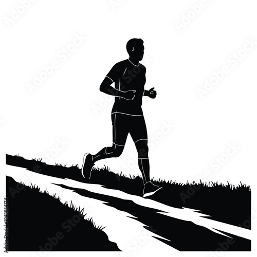 Male runner silhouette training on outdoor trail during morning workout