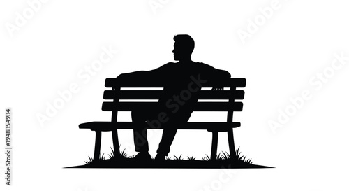 A man sits thoughtfully on a park bench a striking silhouette