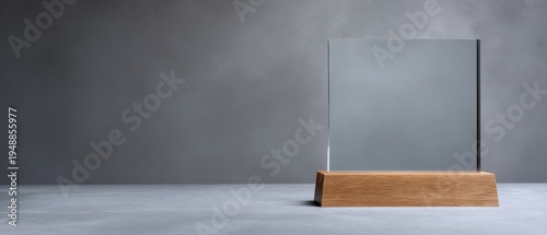 The Glass Award Trophy on Wooden Base with Minimalist Foggy Gray Background