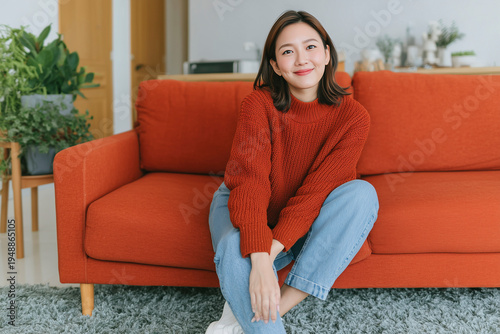 wide angle shot of young woman candid smile with casual cloth sitting in the bright coz home