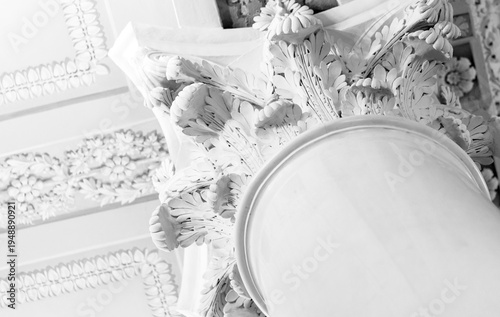 Classical decorative architecture close up photo. Intricate Corinthian capital, abstract white architecture background photography
