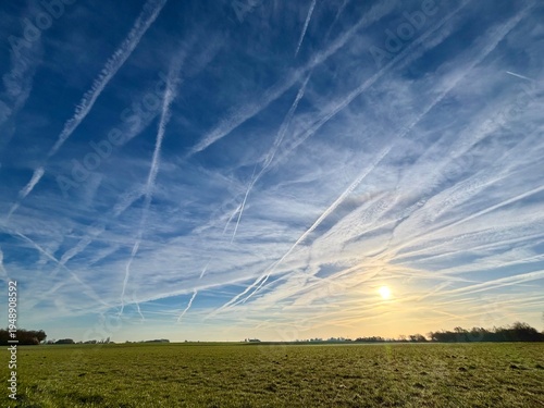 aircraft trails in the blue summer sky