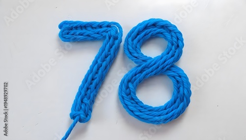Blue knitted number seventy-eight on white background