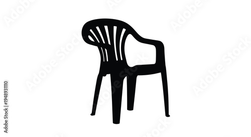 A black plastic chair stands alone against a white background silhouette