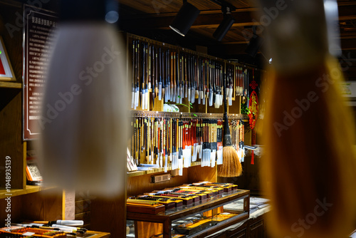 Canvas Print A specialty shop displays countless Chinese calligraphy brushes of various sizes and materials, hanging neatly or standing in containers, ready for artists