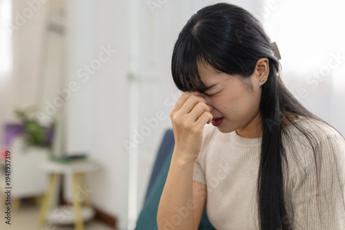 Cuadro en lienzo women suffering from eye strain and headache at home, pinching nose bridge with closed eyes