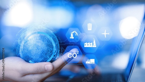 Sustainability manager managing global carbon footprint using digital technology and ESG industry icons. Concept of CO2 reduction, green supply chain, sustainable industry, circular economy
