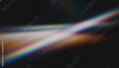 A blurry image of a rainbow colored light beam