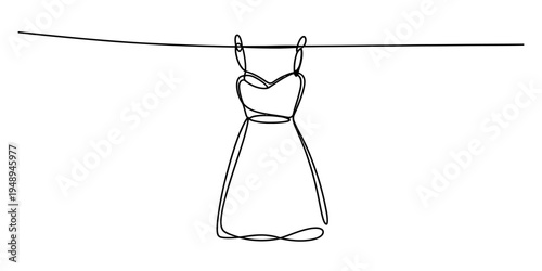 evening gown hanging on a line