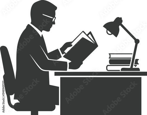 Silhouette of a businessman reading a book at his desk