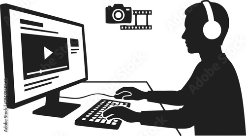 Silhouette of a Video Editor Working at a Computer Desk
