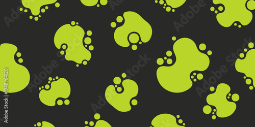 A graphic illustration of various green footprints scattered on a black background.