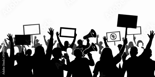 A group of people protesting with signs and megaphones outdoors in a crowd.