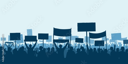 Protesters march through city streets holding signs and banners in a demonstration.