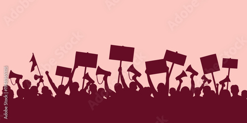 A crowd of people protests with signs and flags in a public demonstration.