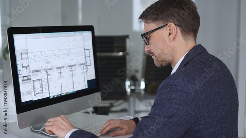 Architect developing building blueprint on computer, engineering and urban planning a new construction project. Business and architecture concept