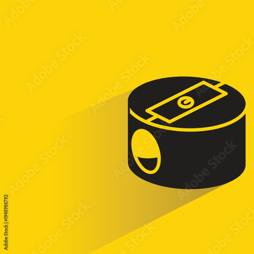 pencil sharpener with shadow on yellow background