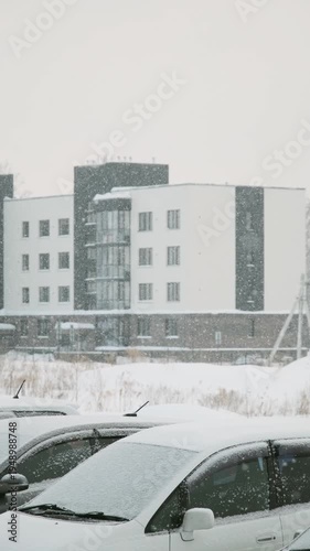 Wallpaper Mural Snow falling against a backdrop of parked cars Torontodigital.ca