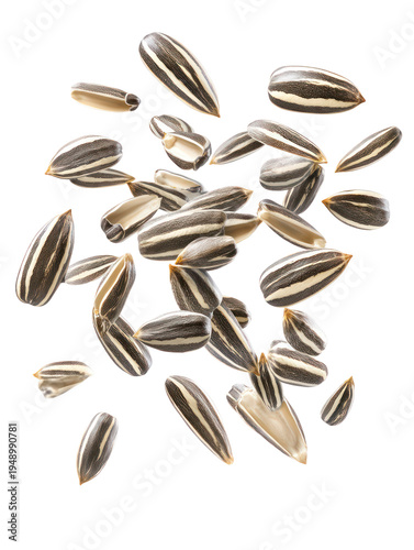 Sunflower seeds floating in mid-air on transparent background