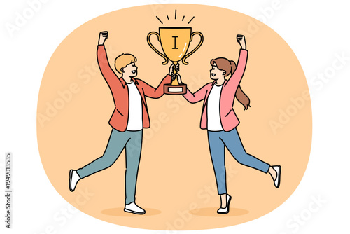 Joint victory of two schoolchildren, joyfully holding golden cup for participating in team intellectual game. Joint victory of children raising hands up after triumphant return from tournament