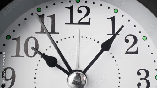 Vintage alarm clock. Old fashioned alarm clock with bells. Time moving. Time concept. Table clock show running time. Close-up in 4K, UHD