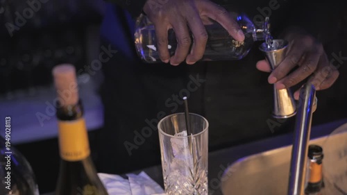 Bartender hands preparing cocktail