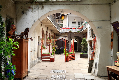 Historic European courtyard with archway, Krakow, Poland