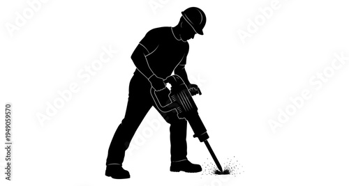 Silhouette of a construction worker operating a jackhammer on concrete