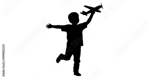 Silhouette of a child playfully reaching for a toy airplane