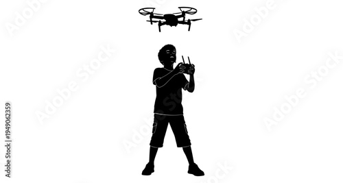 A silhouette of a boy operating a drone with a remote control