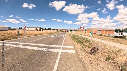 French Way of Saint James - P-980 paved road entering Revenga de Campos, province of Palencia, Castile and Leon, Spain