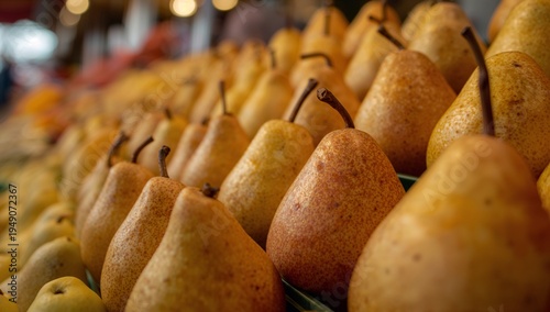 Ripe pears arranged on a farmers market stall. Organic fruit display representing natural produce, healthy nutrition, and fresh grocery shopping.