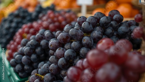 Fresh Black Grapes Pile at Farmers Market Fruit Display