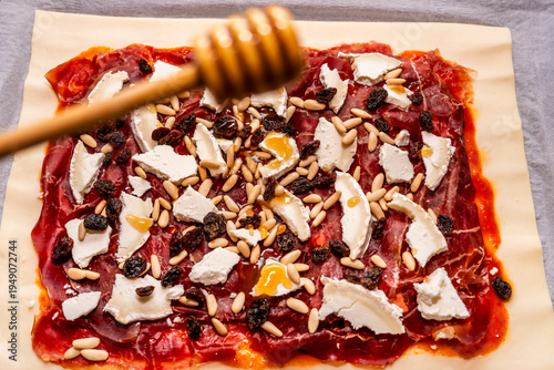 Homemade savory pie with cheese and honey drizzle