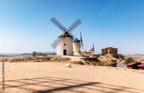 Scenic windmills of La Mancha in sunny Spanish countryside