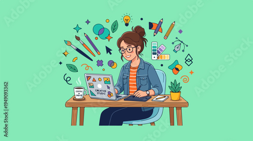 Creative graphic designer working on laptop with design elements.