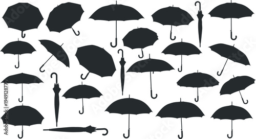 Collection of black silhouette umbrellas on white background