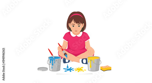 A young girl with brown hair and a pink dress sits cross-legged on a white surface, painting with blue and yellow colors from two buckets.