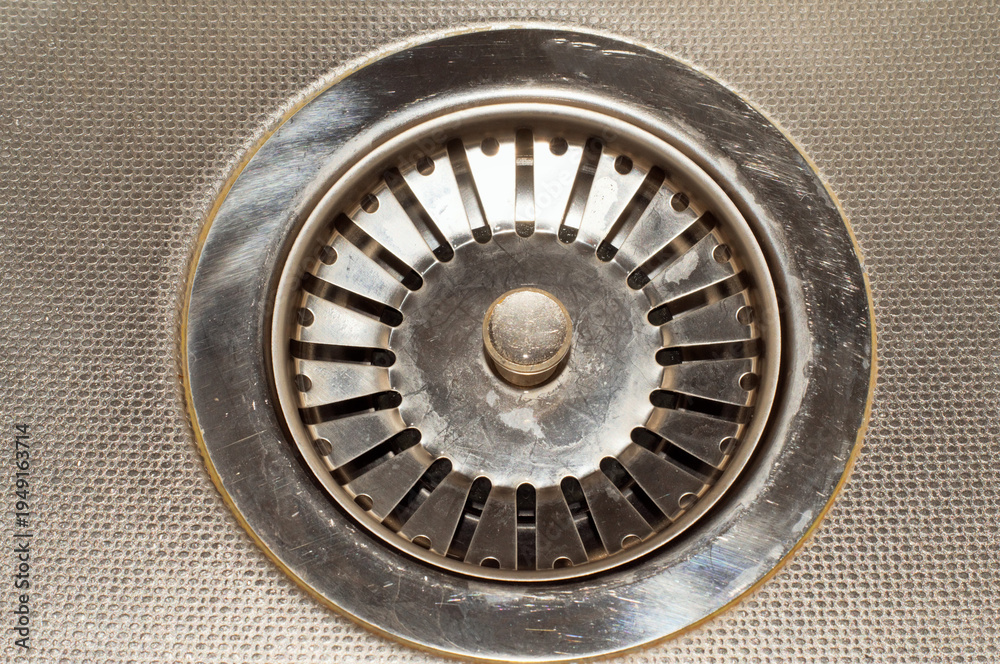 Obraz premium Technological background. Kitchen sink drain hole.