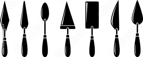 Set of six black and white palette knives with different blade shapes
