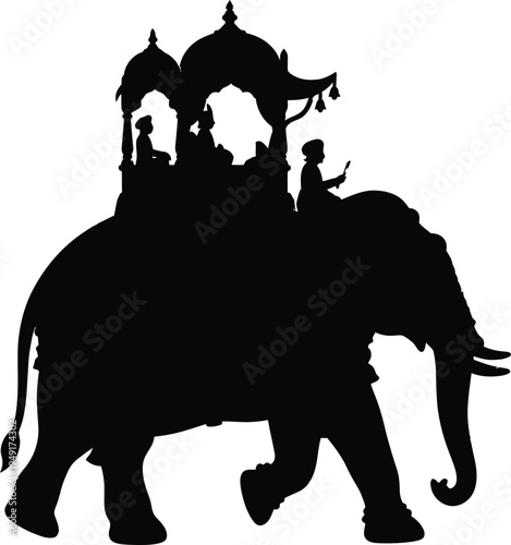 Silhouette of a majestic indian elephant carrying a decorated traditional howdah and riders for royal wedding procession and cultural heritage travel celebrations.