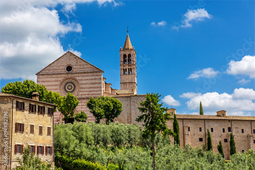 Wallpaper Mural The Basilica of Santa Chiara (Italian: Basilica di Santa Chiara), located in Assisi, Italy, is a Gothic-style church. Its façade is characterized by horizontal bands of pink and white stone. Torontodigital.ca
